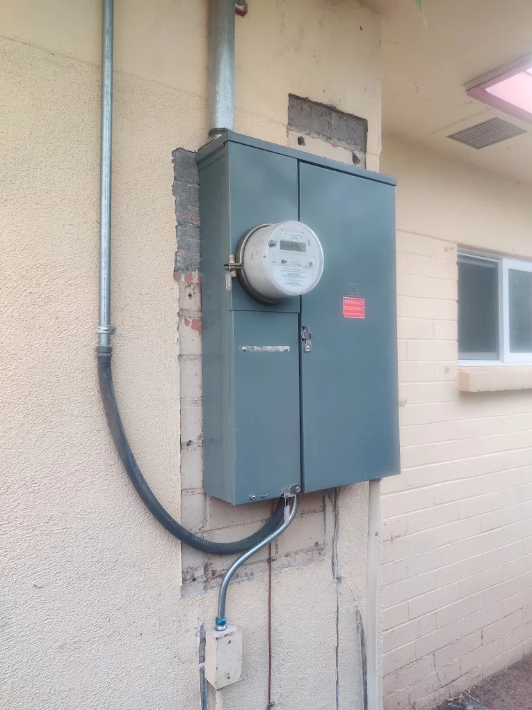 New meter main panel with conduit installed on a stucco wall